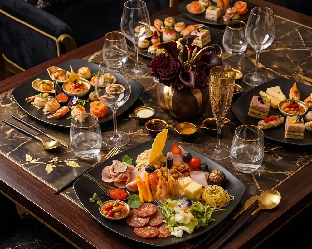 Luxury private dining table with gourmet appetizers, seafood, charcuterie, and elegant table setting prepared by a private chef in Dubai, UAE.