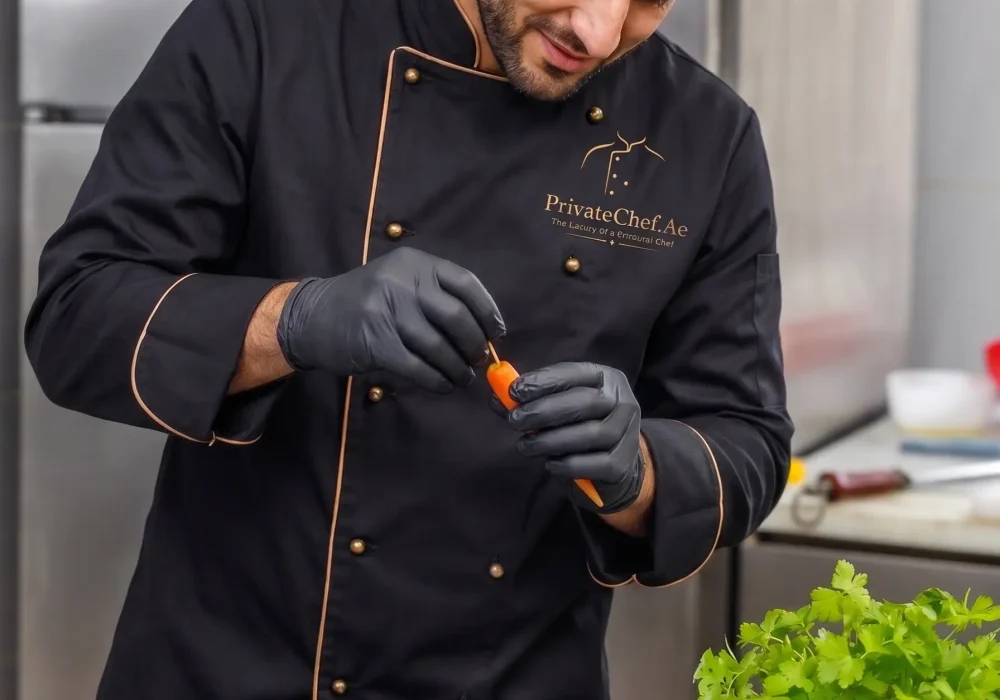 Professional private chef preparing fresh ingredients in a modern kitchen before creating a luxury fine dining experience in Dubai.